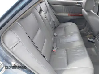 2002 Toyota Camry XLE z VIN 4T1BF32K12U522103, wystawiony jako IAAI lot #42047263 z przebiegiem 293 503 mil mil oraz . Historia ofert i sprzedaży dostępna na DreamBid. Obrazek 8.