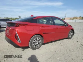 2021 Toyota Prius LE z VIN JTDKAMFP2M3182323, wystawiony jako Copart lot #54396715 z przebiegiem 68 525 mil mil oraz Szkoda całkowita • Salvage title. Historia ofert i sprzedaży dostępna na DreamBid. Obrazek 3.