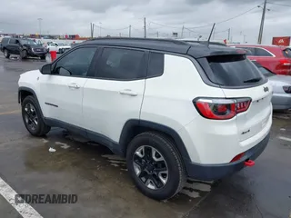 2018 Jeep Compass Trailhawk with VIN 3C4NJDDB0JT306898, listed as a IAAI auction lot 41798954 with 75,852 mi miles and . Bid and sale history available at carsss.com. Image 3.