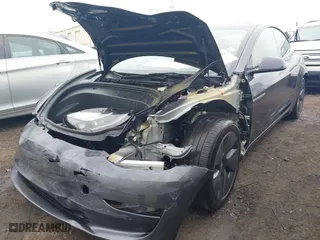 2023 Tesla Model 3 with VIN 5YJ3E1EA7PF642913, listed as a IAAI auction lot 41898249 with 26,394 mi miles. Bid and sale history available at carsss.com. Image 6.