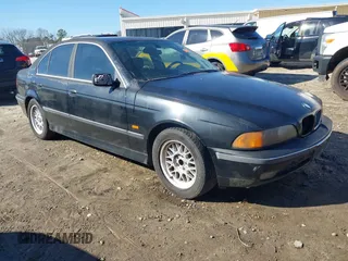 2000 BMW 5 Series 528iA with VIN WBADM634XYGU07489, listed as a IAAI auction lot 41492388 with 128,604 mi miles. Bid and sale history available at carsss.com. Image 1.