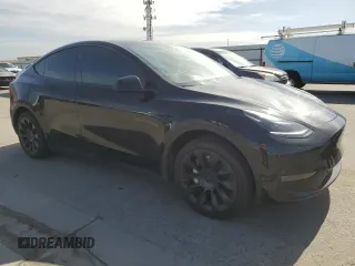 2024 Tesla Model Y with VIN 7SAYGDED0RF131495, listed as a Copart auction lot 56849765 with 10,120 mi miles and Salvage title. Bid and sale history available at DreamBid. Image 4.