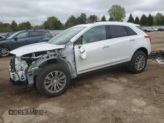 2019 Cadillac XT5 Luxury AWD with VIN 1GYKNDRS2KZ200764, listed as a Copart auction lot 55686305 with 67,495 mi miles and Salvage title. Bid and sale history available at DreamBid. Image 1.