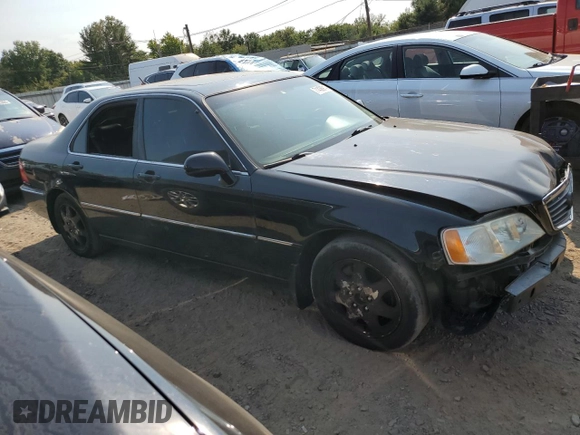 2002 Acura RL with VIN JH4KA96512C013028, listed as a Copart auction lot 71436914 with 142,527 mi miles and Salvage Title. Bid and sale history available at carsss.com. Image 4.