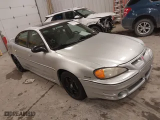 2004 Pontiac Grand Am GT with VIN 1G2NW52E04M617802, listed as a IAAI auction lot 41353209 with 103,716 mi miles. Bid and sale history available at carsss.com. Image 1.