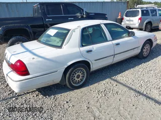2004 Mercury Grand Marquis GS z VIN 2MEFM74W74X654151, wystawiony jako IAAI lot #42185493 z przebiegiem 203 017 mil mil oraz . Historia ofert i sprzedaży dostępna na DreamBid. Obrazek 4.