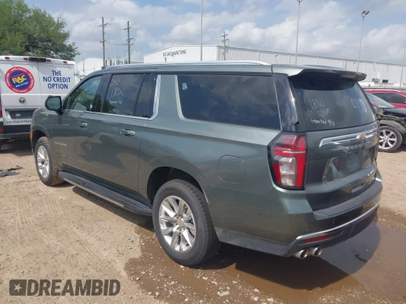 2023 Chevrolet Suburban Premier with VIN 1GNSCFKD6PR393843, listed as a IAAI auction lot 42101935 with 59,604 mi miles. Bid and sale history available at carsss.com. Image 3.
