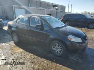 2012 Suzuki SX4 LE with VIN JS2YC5A3XC6303083, listed as a Copart auction lot 89265635 with 155,316 mi miles and Salvage Title. Bid and sale history available at carsss.com. Image 4.