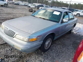 1996 Mercury Grand Marquis GS with VIN 2MELM74W7TX616694, listed as a IAAI auction lot 41216582 with 127,486 mi miles and . Bid and sale history available at DreamBid. Image 2.