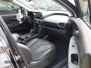 2020 Hyundai Santa Fe Limited with VIN 5NMS53AA2LH301974, listed as a IAAI auction lot 41614588 with 104,621 mi miles. Bid and sale history available at carsss.com. Image 5.