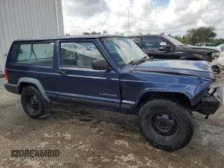 1997 Jeep Cherokee SE with VIN 1J4FT27P0VL612859, listed as a Copart auction lot 49869915 with 198,702 mi miles and Salvage title. Bid and sale history available at DreamBid. Image 4.