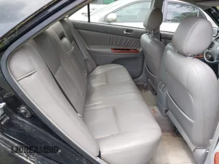 2003 Toyota Camry LE with VIN JTDBF32K430146557, listed as a IAAI auction lot 42102454 with 179,653 mi miles. Bid and sale history available at carsss.com. Image 8.