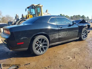 2013 Dodge Challenger SXT with VIN 2C3CDYAG5DH562557, listed as a IAAI auction lot 41694697 with 135,915 mi miles. Bid and sale history available at carsss.com. Image 4.