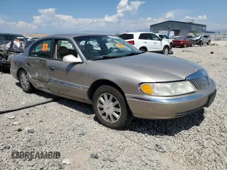 2001 Lincoln Continental with VIN 1LNHM97V21Y698784, listed as a Copart auction lot 64040134 with Not Provided miles and Salvage Title. Bid and sale history available at DreamBid. Image 4.