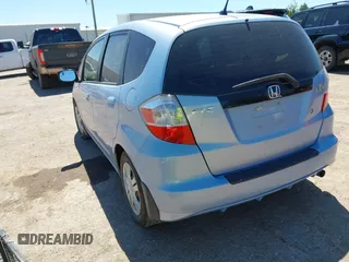 2009 Honda Fit z VIN JHMGE88209S011973, wystawiony jako IAAI lot #42300503 z przebiegiem 106 083 mil mil oraz . Historia ofert i sprzedaży dostępna na DreamBid. Obrazek 3.