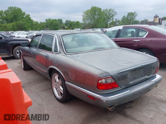 2002 Jaguar XJ with VIN SAJDA12CX2LF49531, listed as a IAAI auction lot 42124743 with 120,486 mi miles. Bid and sale history available at carsss.com. Image 3.