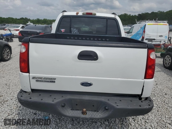 2005 Ford Explorer Sport Trac XLS with VIN 1FMZU67K85UA59170, listed as a Copart auction lot 54472775 with 227,225 mi miles and Salvage title. Bid and sale history available at DreamBid. Image 6.