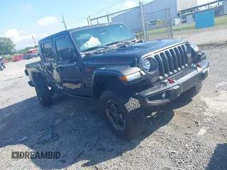 2021 Jeep Gladiator Rubicon z VIN 1C6JJTBG9ML592538, wystawiony jako IAAI lot #42206035 z przebiegiem 37 945 mil mil oraz . Historia ofert i sprzedaży dostępna na DreamBid. Obrazek 1.