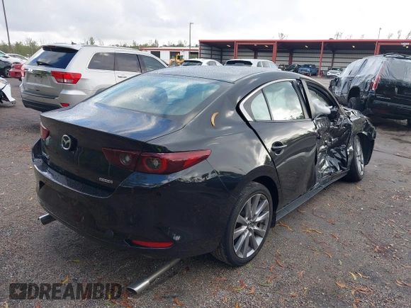 2023 Mazda 3 S Preferred with VIN 3MZBPACM6PM358989, listed as a IAAI auction lot 41120246 with 27,290 mi miles and . Bid and sale history available at DreamBid. Image 4.
