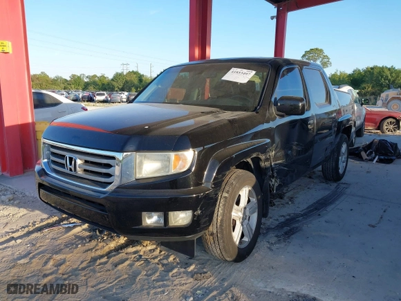2012 Honda Ridgeline RTL with VIN 5FPYK1F51CB452400, listed as a IAAI auction lot 41853497 with 157,131 mi miles. Bid and sale history available at carsss.com. Image 17.