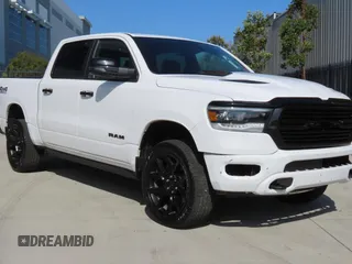 2023 Ram 1500 Laramie with VIN 1C6SRFJM9PN556833, listed as a Copart auction lot 59050235 with 13,214 mi miles and Salvage title. Bid and sale history available at DreamBid. Image 1.
