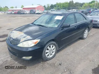 2003 Toyota Camry LE with VIN 4T1BE30K33U243758, listed as a IAAI auction lot 42169032 with 260,336 mi miles and . Bid and sale history available at DreamBid. Image 2.