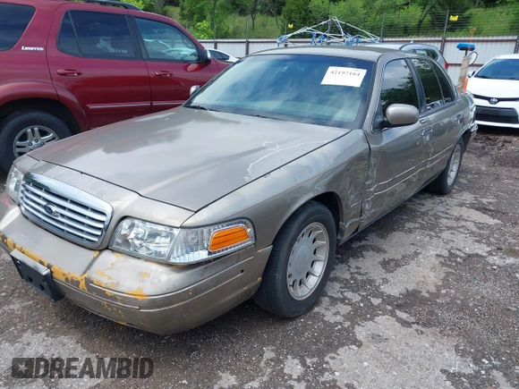 2002 Ford Crown Victoria LX z VIN 2FAFP74W52X112493, wystawiony jako IAAI lot #42197164 z przebiegiem 103 941 mil mil oraz . Historia ofert i sprzedaży dostępna na DreamBid. Obrazek 2.