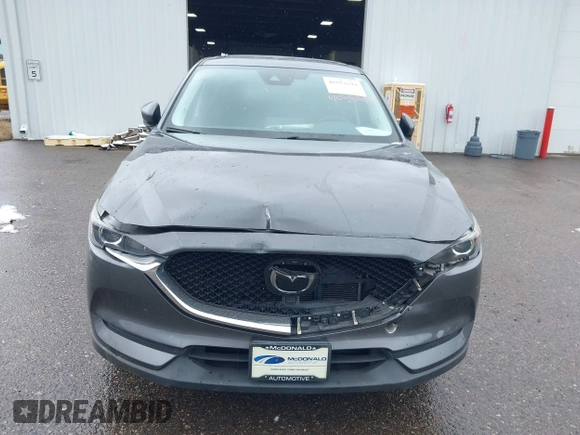 2021 Mazda CX-5 Touring with VIN JM3KFBCM8M0311433, listed as a IAAI auction lot 40554094 with 23,319 mi miles. Bid and sale history available at carsss.com. Image 12.
