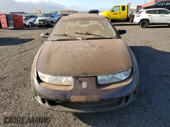 1999 Saturn SC z VIN 1G8ZR1274XZ262181, wystawiony jako Copart lot #75931774 z przebiegiem Nie podano mil oraz Szkoda całkowita • Salvage title. Historia ofert i sprzedaży dostępna na DreamBid. Obrazek 5.
