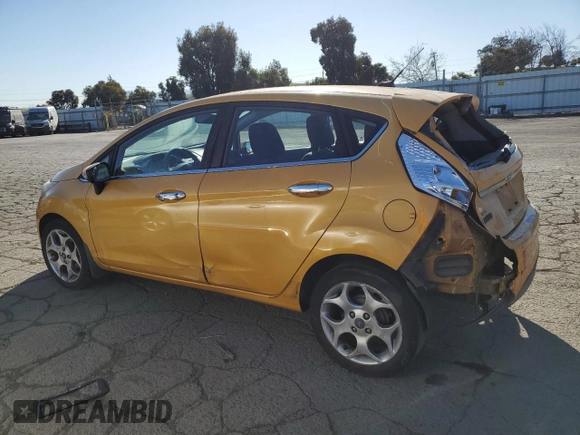 2011 Ford Fiesta SES with VIN 3FADP4FJ6BM124655, listed as a Copart auction lot 42670165 with 112,008 mi miles and Salvage Title. Bid and sale history available at carsss.com. Image 2.