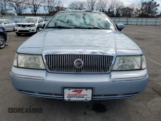 2005 Mercury Grand Marquis GS z VIN 2MEFM74W25X624329, wystawiony jako Copart lot #50945805 z przebiegiem 140 717 mil mil oraz Tytuł czysty. Historia ofert i sprzedaży dostępna na DreamBid. Obrazek 5.