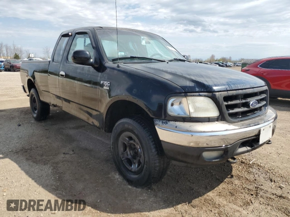 1999 Ford F-150 with VIN 1FTRX18W1XKC00918, listed as a Copart auction lot 53830305 with 205,205 mi miles and Salvage title. Bid and sale history available at DreamBid. Image 4.