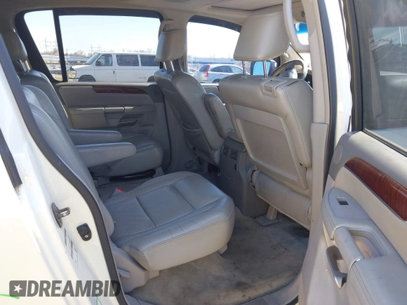 2010 Infiniti QX56 with VIN 5N3ZA0NE7AN909000, listed as a IAAI auction lot 42044598 with 284,698 mi miles. Bid and sale history available at carsss.com. Image 8.