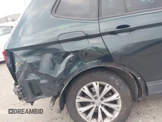 2019 Volkswagen Tiguan S with VIN 3VV1B7AXXKM002312, listed as a IAAI auction lot 42282809 with 80,781 mi miles and . Bid and sale history available at DreamBid. Image 6.