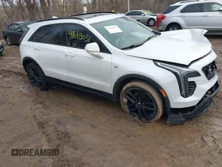 2019 Cadillac XT4 AWD Sport z VIN 1GYFZFR44KF146971, wystawiony jako IAAI lot #41663031 z przebiegiem 129 248 mil mil oraz . Historia ofert i sprzedaży dostępna na DreamBid. Obrazek 1.