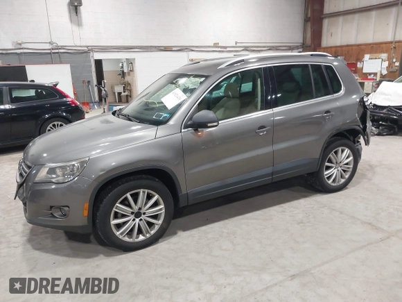 2011 Volkswagen Tiguan SE with VIN WVGBV7AX9BW524807, listed as a IAAI auction lot 41921439 with 204,813 mi miles and . Bid and sale history available at DreamBid. Image 2.