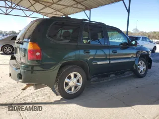 2004 GMC Envoy SLT z VIN 1GKDS13S942127830, wystawiony jako Copart lot #87165024 z przebiegiem 172 592 mil mil oraz Szkoda całkowita • Salvage title. Historia ofert i sprzedaży dostępna na DreamBid. Obrazek 3.