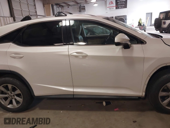2018 Lexus RX 350 z VIN 2T2BZMCA5JC144530, wystawiony jako IAAI lot #41417396 z przebiegiem 97 860 mil mil oraz . Historia ofert i sprzedaży dostępna na DreamBid. Obrazek 13.