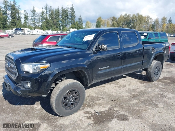 2016 Toyota Tacoma SR5 with VIN 5TFDZ5BN7GX001869, listed as a IAAI auction lot 40610002 with 184,380 mi miles. Bid and sale history available at carsss.com. Image 2.