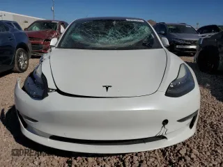2020 Tesla Model 3 Standard Range Plus with VIN 5YJ3E1EA4LF799597, listed as a Copart auction lot 76401374 with 77,506 mi miles and Salvage Title. Bid and sale history available at DreamBid. Image 5.
