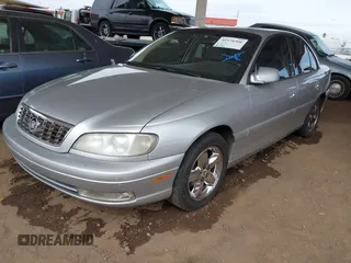 2001 Cadillac Catera z VIN W06VR54R51R058055, wystawiony jako IAAI lot #41574366 z przebiegiem 141 543 mil mil oraz . Historia ofert i sprzedaży dostępna na DreamBid. Obrazek 2.
