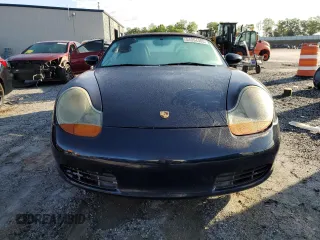 2000 Porsche Boxster с VIN WP0CA2989YU627749, выставлен на аукционе Copart как лот 54054305 с пробегом 189 173 миль миль и Списание • Salvage title. История ставок и продаж доступна на DreamBid. Изображение 5.