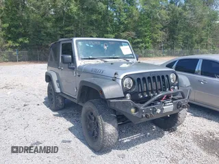 2015 Jeep Wrangler Freedom Edition z VIN 1C4AJWAG4FL589769, wystawiony jako IAAI lot #42704488 z przebiegiem 194 414 mil mil oraz . Historia ofert i sprzedaży dostępna na DreamBid. Obrazek 1.
