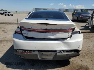 2013 Lincoln MKZ z VIN 3LN6L2GKXDR814615, wystawiony jako Copart lot #65654335 z przebiegiem 100 510 mil mil oraz Szkoda całkowita • Salvage title. Historia ofert i sprzedaży dostępna na DreamBid. Obrazek 6.