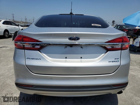 2018 Ford Fusion SE z VIN 3FA6P0LU8JR110693, wystawiony jako Copart lot #61931995 z przebiegiem 119 629 mil mil oraz Szkoda całkowita • Salvage title. Historia ofert i sprzedaży dostępna na DreamBid. Obrazek 6.
