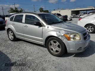2009 Dodge Caliber SXT with VIN 1B3HB48AX9D157186, listed as a Copart auction lot 52892065 with 218,024 mi miles and Salvage Title. Bid and sale history available at carsss.com. Image 4.