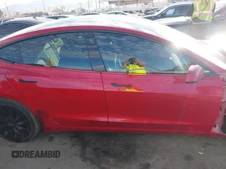 2022 Tesla Model 3 with VIN 5YJ3E1EA1NF288903, listed as a IAAI auction lot 41610215 with 96,050 mi miles and . Bid and sale history available at DreamBid. Image 13.
