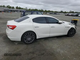 2018 Maserati Ghibli z VIN ZAM57XSA9J1271727, wystawiony jako Copart lot #52155305 z przebiegiem 62 081 mil mil oraz Szkoda całkowita • Salvage title. Historia ofert i sprzedaży dostępna na DreamBid. Obrazek 3.