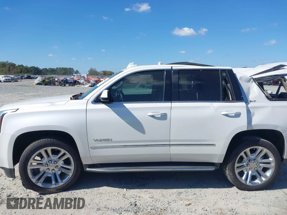 2019 GMC Yukon SLT with VIN 1GKS1BKC9KR332014, listed as a IAAI auction lot 40674460 with 76,545 mi miles. Bid and sale history available at carsss.com. Image 14.