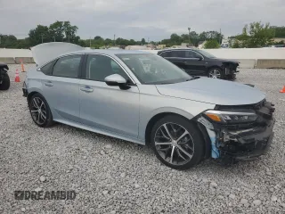 2023 Honda Civic Touring z VIN 2HGFE1F96PH311589, wystawiony jako Copart lot #58594035 z przebiegiem 17 762 mil mil oraz Szkoda całkowita • Salvage title. Historia ofert i sprzedaży dostępna na DreamBid. Obrazek 4.